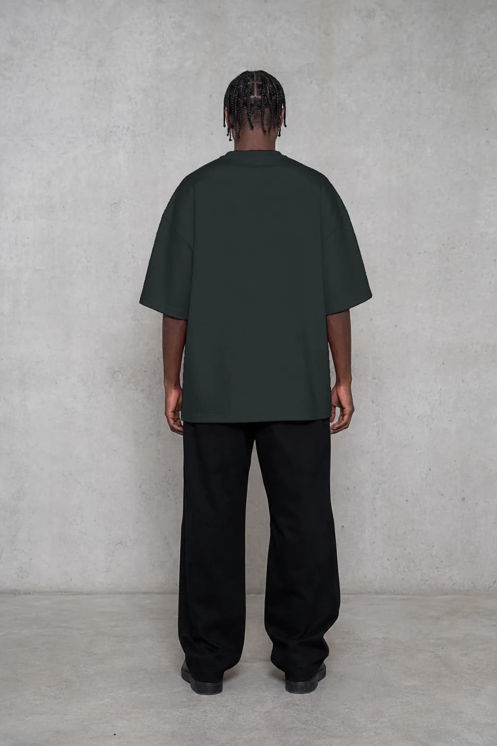 Abyss heavyweight T-shirt, back fit on a Black adult model, personalized with number —
