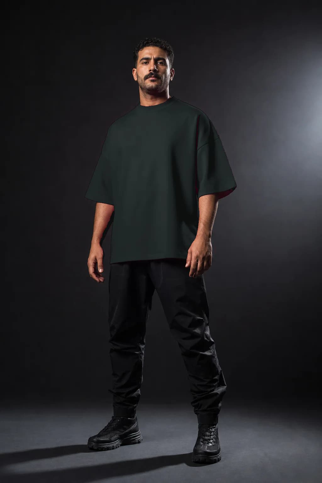 Abyss heavyweight T-shirt, three-quarter fit on a Middle Eastern adult model, personalized with number —